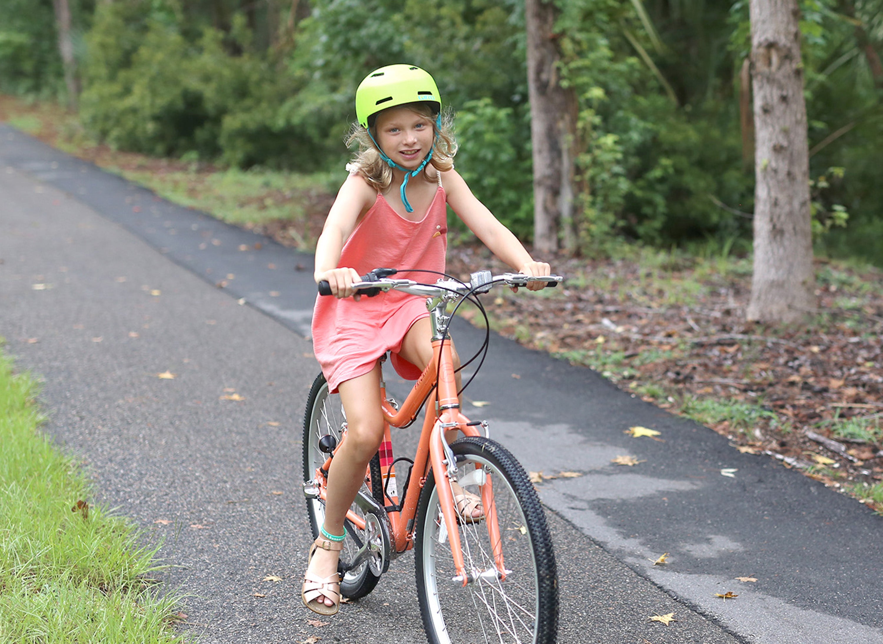 Girl riding flous bike without seat